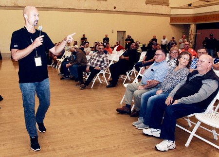 Matt Tall, vice president of manufacturing, answers questions from the audience in the Hanford Civic Auditorium.